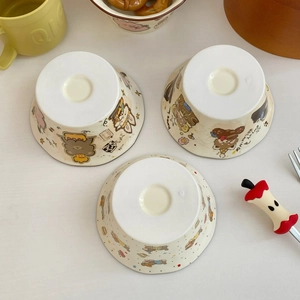 Three-piece ceramic bowl set with cute cartoon animal illustrations and cream glaze finish