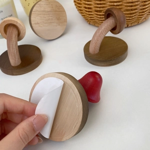 Handcrafted mushroom wood wall hooks with adhesive backing for easy drill-free mounting