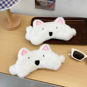 Detail of plush animal sleep masks with soft white faux fur and pink plaid ear accents
