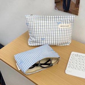 Minimalist blue checkered and striped makeup bags with bow embroidery and zipper closure