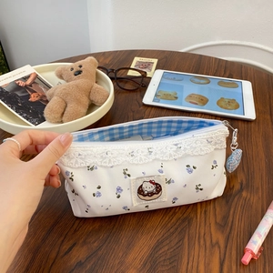 Floral pencil case with lace trim, Hello Kitty donut patch and heart zipper charm