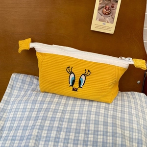Yellow corduroy pencil case with cartoon bird eyes embroidery and zipper closure