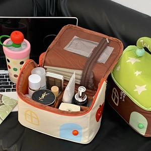Detailed interior of the star house makeup bag showing spacious main compartment and mesh pocket