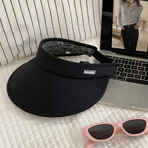 Detail of black open top sun visor with wide brim and comfortable inner lining fabric