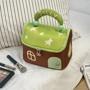 Detail of creative house-shaped cosmetic bag with JOLLY star handle and door appliqué