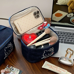 Blue denim cosmetic bag with cat embroidery and large capacity for travel storage