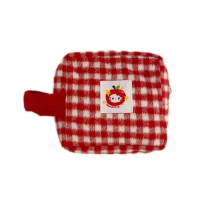 Red and white checkered makeup bag featuring a cute character patch with top handle