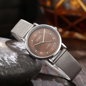 Detail of elegant ladies quartz watch with roman numerals on dark stone background