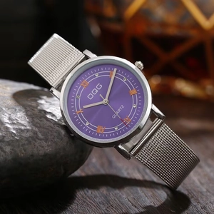 Detail of purple dial with Roman numerals and mesh band on dark textured background