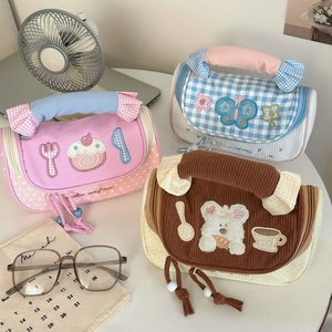 Detailed view of cute macaron color-block pencil cases in various patterns and textures