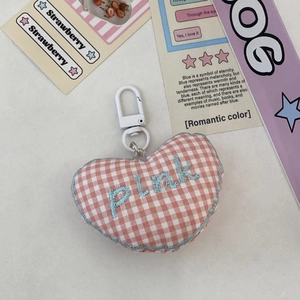 Detail of pink plaid heart keychain with blue PINK embroidery and white plastic swivel hook