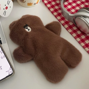 Detailed view of Brown bear plush pencil case on a cozy desk with aesthetic accessories
