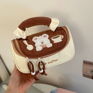 Detail of macaron color-block pencil case with brown corduroy and cute bear embroidery