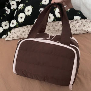 Brown quilted travel makeup bag with pink zipper and large capacity dual compartment