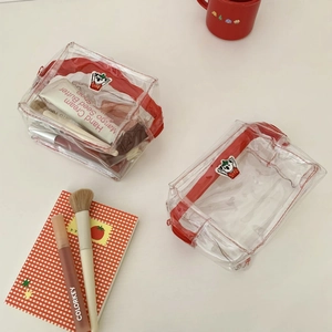 Clear PVC cosmetic bags with cute koala patches and red zippers for makeup storage