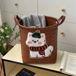 Brown woven storage basket with cute puppy embroidery and dual handles for home organization