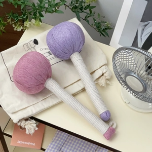 Detail view of herbal moxibustion massage hammers with woven handles and a canvas storage bag