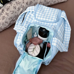 Blue checkered makeup bag with large capacity and multi-compartment interior for travel