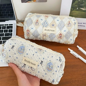Detail of quilted bubble cotton pencil pouch with cute bear patterns and metal zipper