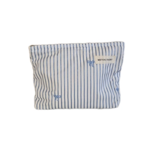 Blue striped cotton cosmetic bag with bow embroidery and top opening for travel