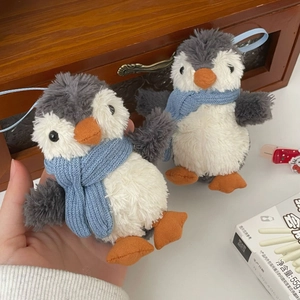 Plush penguin keychain with blue scarf and grey-white fur hanging ornament decor