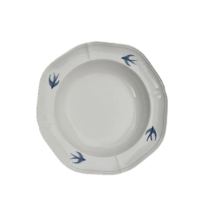 Octagonal ceramic plate with embossed blue swallow patterns and smooth cream glaze finish
