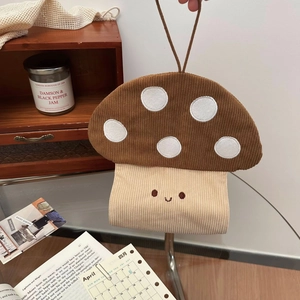 Detail of mushroom tissue holder with corduroy texture and cute embroidered face
