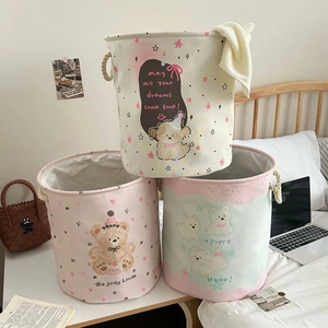 Three-piece cylindrical canvas laundry hamper set with cute dog animal patterns and rope handles