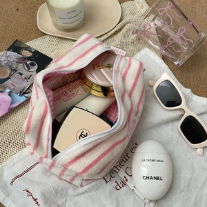 Pink and white striped plush makeup bag for women with spacious interior storage