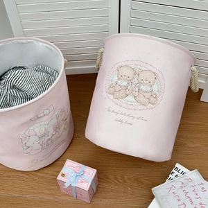 Pink cartoon bear laundry basket featuring thick rope handles and a large storage capacity