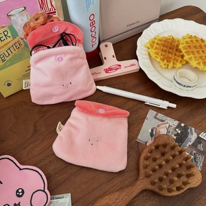 Detailed view of pink plush mini pouches with snap buttons and soft checkered lining