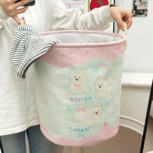 Detail of cartoon puppy laundry basket with durable white cotton rope handles
