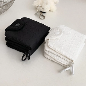 Quilted pleated coin purse in black and white with snap closure and side hook