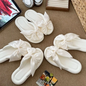 Summer platform flip-flops with silk oversized bow detail shown in multiple angles