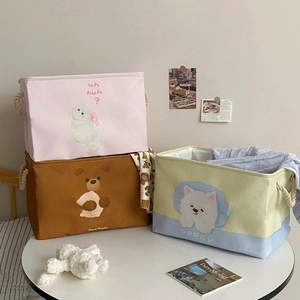 Detail of canvas folding baskets with animal patterns and sturdy cotton rope handles
