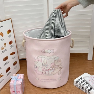 Pink cartoon laundry hamper with rope handles and cute bear motifs for home storage