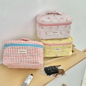 Quilted checkerboard cosmetic bags with embroidered bows and top handles set