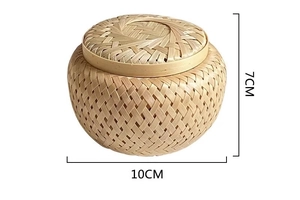 Detail view of a handcrafted bamboo storage box showing 10x7cm dimensions and weave texture