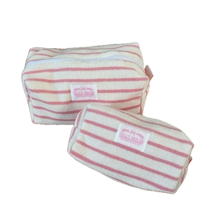 Pink and white striped terry cloth cosmetic bags in two sizes with JOLLY HOUSE label