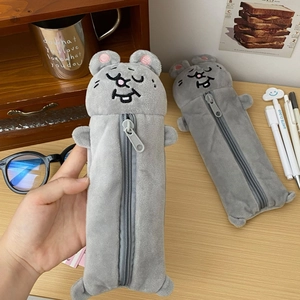 Detail of plush grey hamster pencil case with soft texture and durable vertical zipper