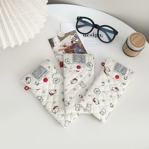 Quilted cartoon cat sunglasses pouch with button closure and minimalist home setup