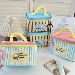 Striped puppy cosmetic bags with handles in blue and brown showing cute dog graphics