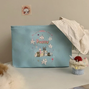 Detail of blue storage bag with cute puppy cartoon print and happy text design