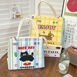 Detail of insulated lunch bags with cartoon prints and thick aluminum foil lining
