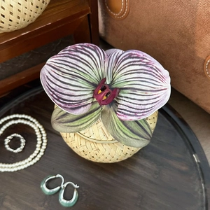Bamboo storage box featuring a realistic orchid flower and a set of pearl jewelry