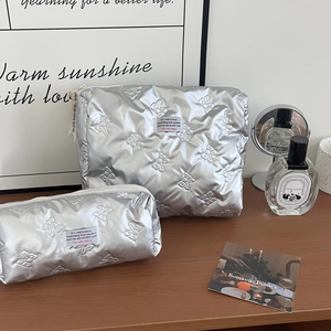 Quilted silver makeup bag set with 3D butterfly patterns and sleek metallic finish
