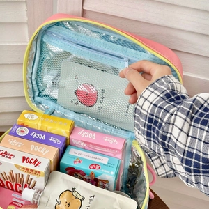 Detail view of large striped lunch bag with mesh pocket and thermal foil lining