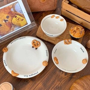 Creative croissant embossed ceramic dinnerware set with bowls and plates on wooden tray