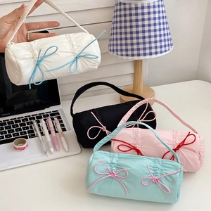 Candy-colored bow pencil cases in four colors with ruffled nylon and handles