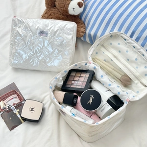 White pearlescent bow quilted makeup bag set for travel storage with zipper closure